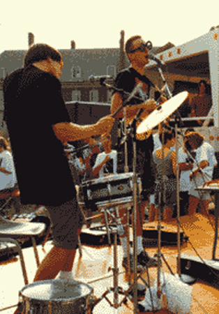 a band playing at an outdoor concert in Urbana IL ~1990, photo copyright ; 1990-2013 Janet Kuypers