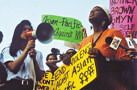 women protesting in a “Take Back the Night” rally in Urbaa Illinois in 1991, copyright © 1991-2013 Janet Kuypers