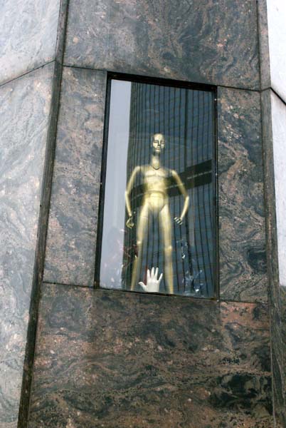a naked mannequin on display at a downtown Chicago storefront