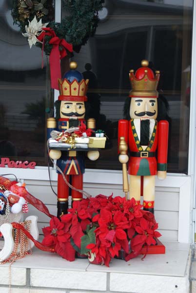2 nutcrackers Kuypers sees whenever she is walking outside in Naples Florids (on Blue Bsys Drive), that she decided to name Garret and Bartholomew, to create this story, because she has a large stock nutcrackers in her own home for the Christmas season every year... Image copyright ©l 2012-2013 Janet Kuypersof 
