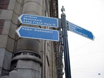 Image of sign pointing the direction to the Anne Frank House in Luxembourg, Copyright © 2003-2018 Janet Kuypers