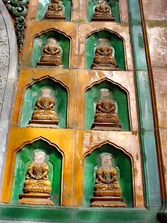 a wall of headless Buddhas at Summer Palace in Brijing, China