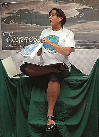 Janet reading a poem in her show, photo by John Yotko