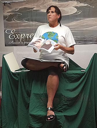 Janet reading a poem in her show, photo by John Yotko