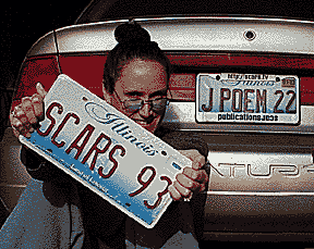Kuypers at her car with 2 license plates