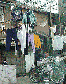 clothes hanging to dry on a Shanghai China streetside, (c) Janet Kuypers