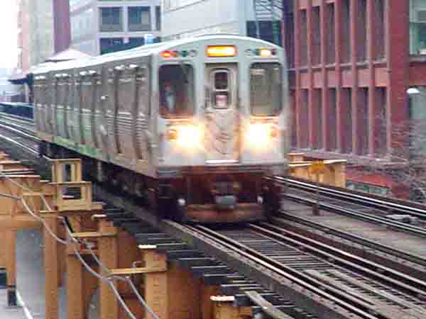 the “L” train ridin in the loop in Chicago 11/27/03 in Chicago, photograph copyright © 2003-2013 Janet Kuypers