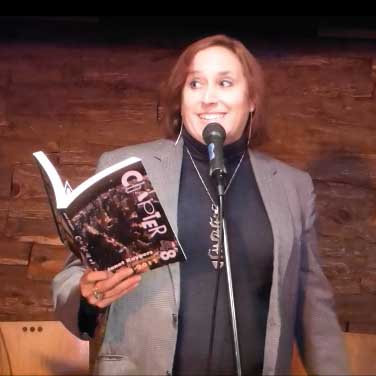 video still form Janet Kuypers reading a poem from this book at Austin’s Fort to Famous at The Buzz Mill 10/15/18