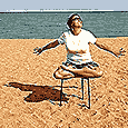 Janet in the lotus position on a table at Illinois Beach State Park
