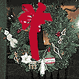 Janet holding large Christmas wreath