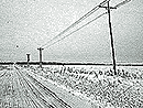 wires for poles along a snowy road Near Clay City, IN