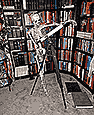 skeleton at telescope in library