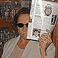 Janet Kuypers holding an open Fancy Food Magazine issue she designed with a picture of Charlie Trotter on the page (in 1997)