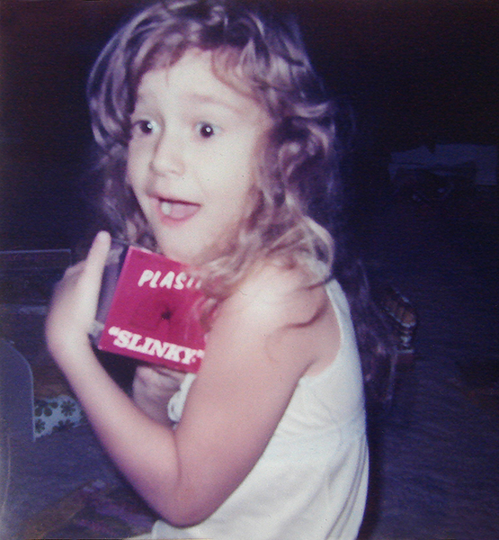 Janet getting a Slinky for Christmas when she was little