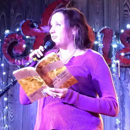 Janet with the book “Rape, Sexism, Life & Death” at Kick Butt Coffee: Spoken and Heard 1/3/16