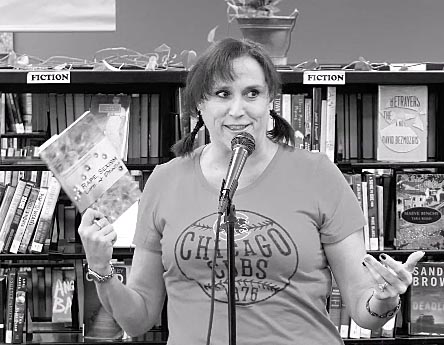 Janet with the book “Rape, Sexism, Life & Death” at Recycled Reads 10/21/17