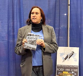 Janet with the book “Give me the News” at the AIPF booth during the Awesmic City Expo 12/16/17