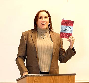 Janet with the book “Rape, Sexism, Life & Death” at Poetry Aloud 1/13/18