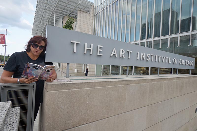 Janet with book &38220;(pheromemes) 2015-2017 show poems” at the Art Institute of Chicago