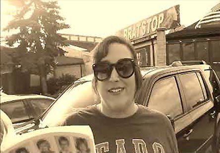 video still from Janet Kuypers reading from the book in from of the Brat Stop restaurant in Kenosha, WI 9/2/19